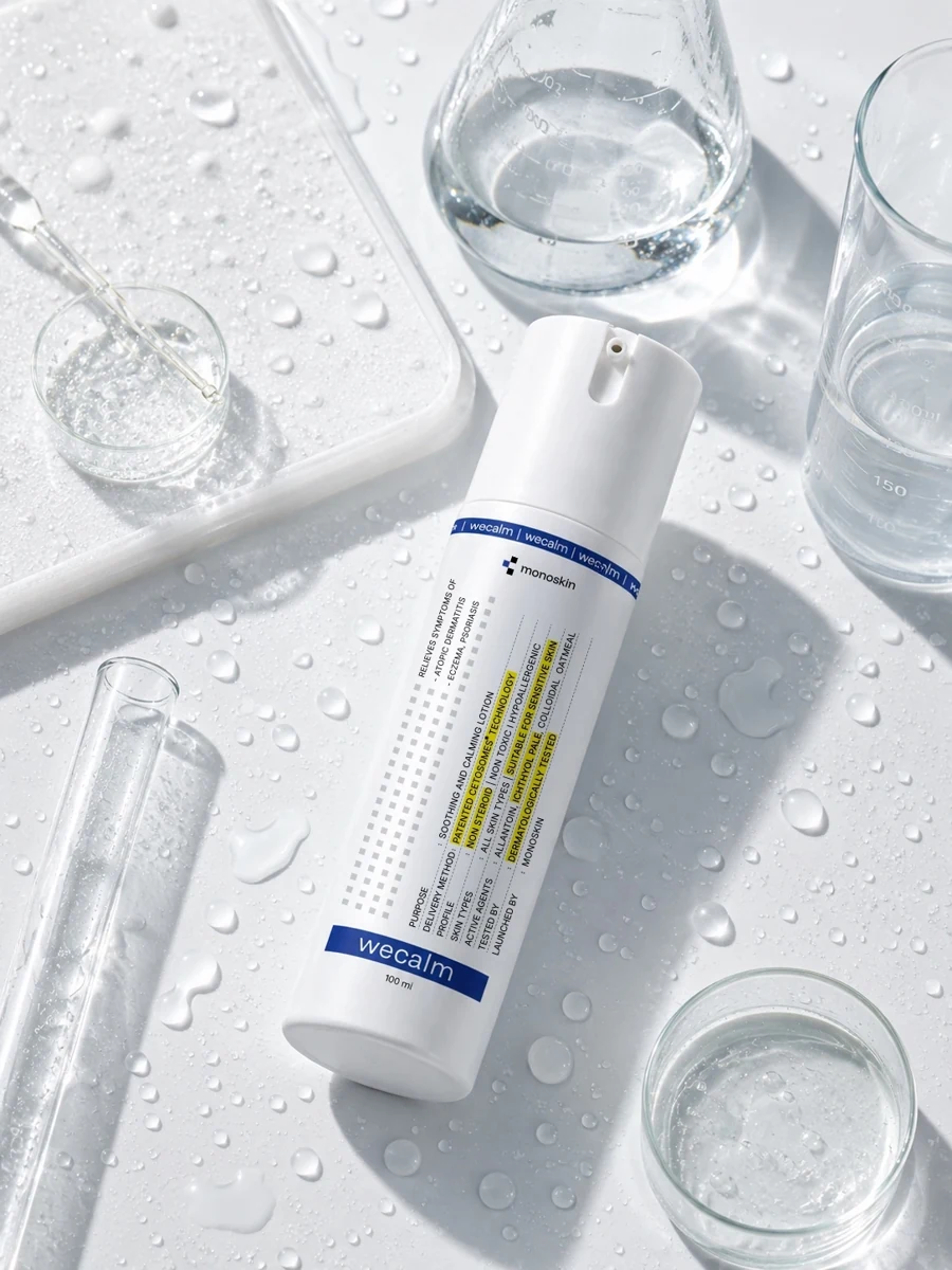 WECALM bottle with water droplets and clear laboratory glassware